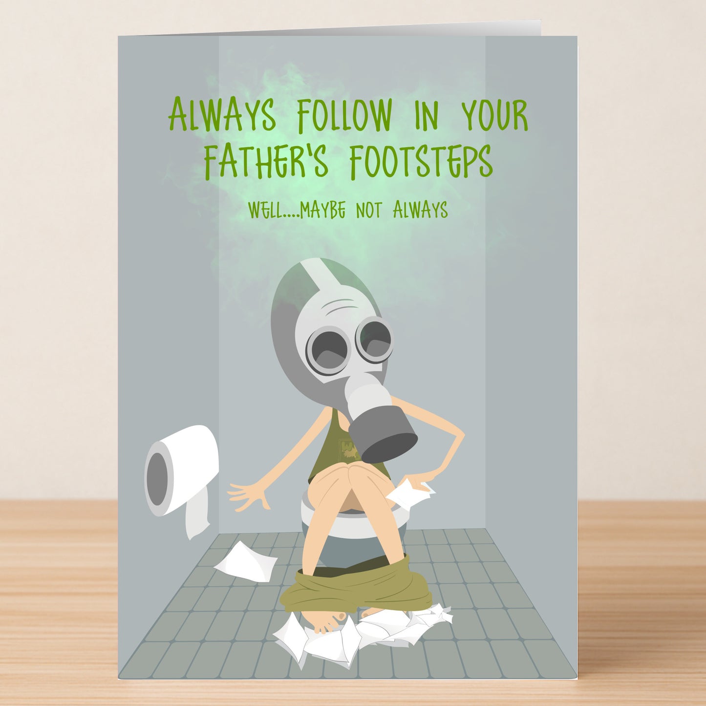 Make Dad laugh with the Father's Footsteps Funny Day Card from Twisted Gifts—a cartoon of someone in a gas mask on a toilet, surrounded by TP, with the message: "Always follow in your father's footsteps. Well...maybe not always!.