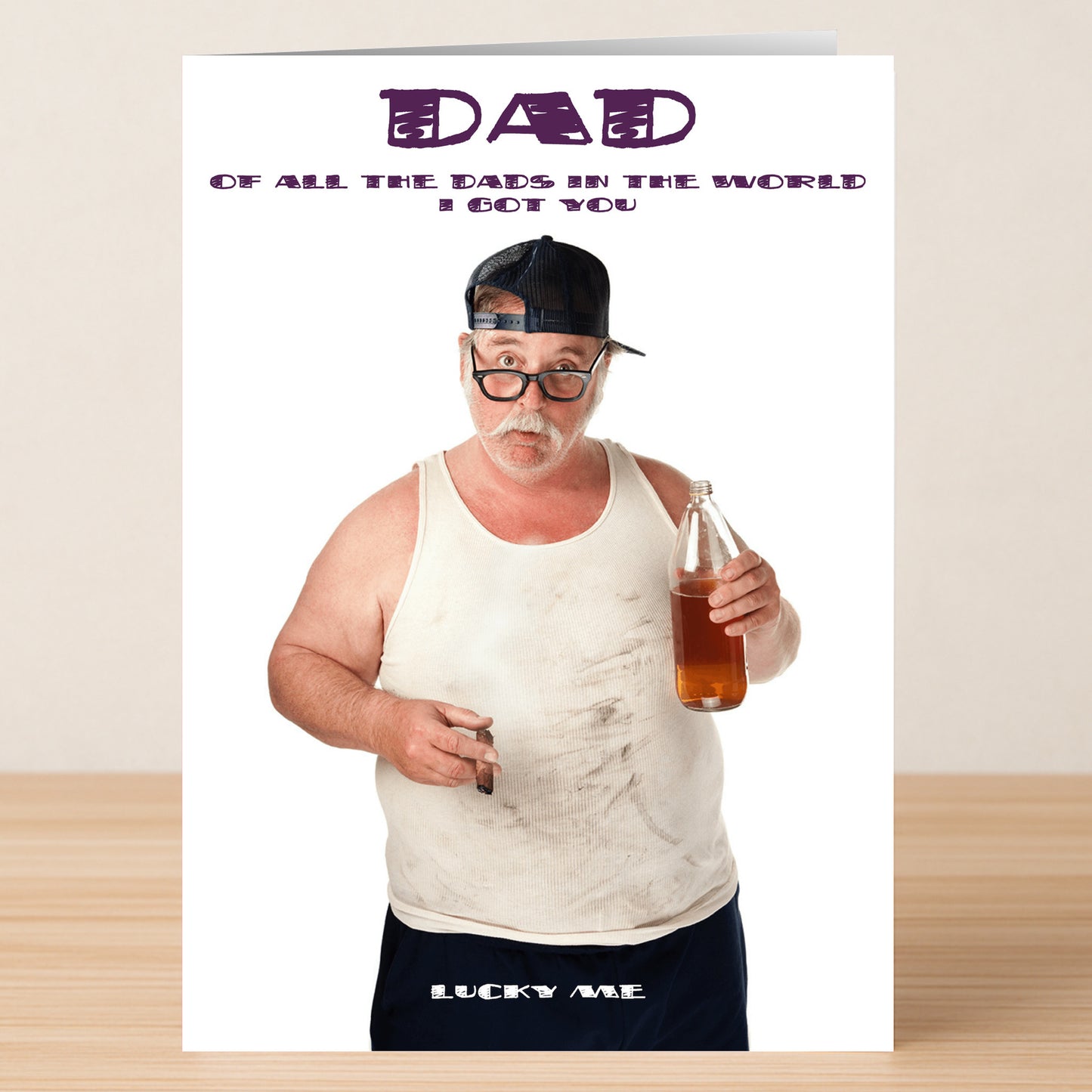 The Lucky Me Funny Father's Day Card by Twisted Gifts features a man in a backwards cap, glasses, dirty tank top, and shorts holding a brown bottle and cigarette—perfect for dads with a sense of humor.