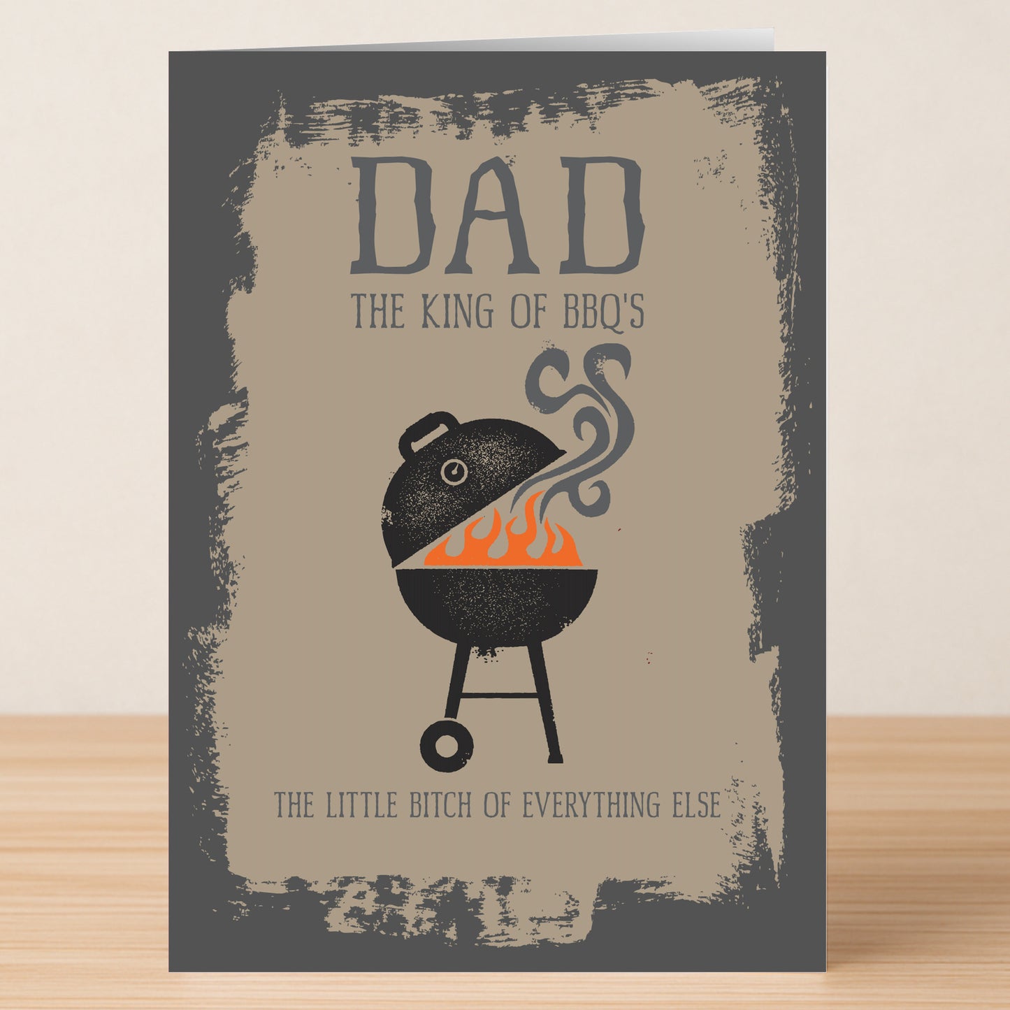 Twisted Gifts BBQ Rude Father’s Day Card features a barbecue grill and the text: "Dad, the king of BBQ's, the little bitch of everything else." Perfect funny card for Father’s Day.