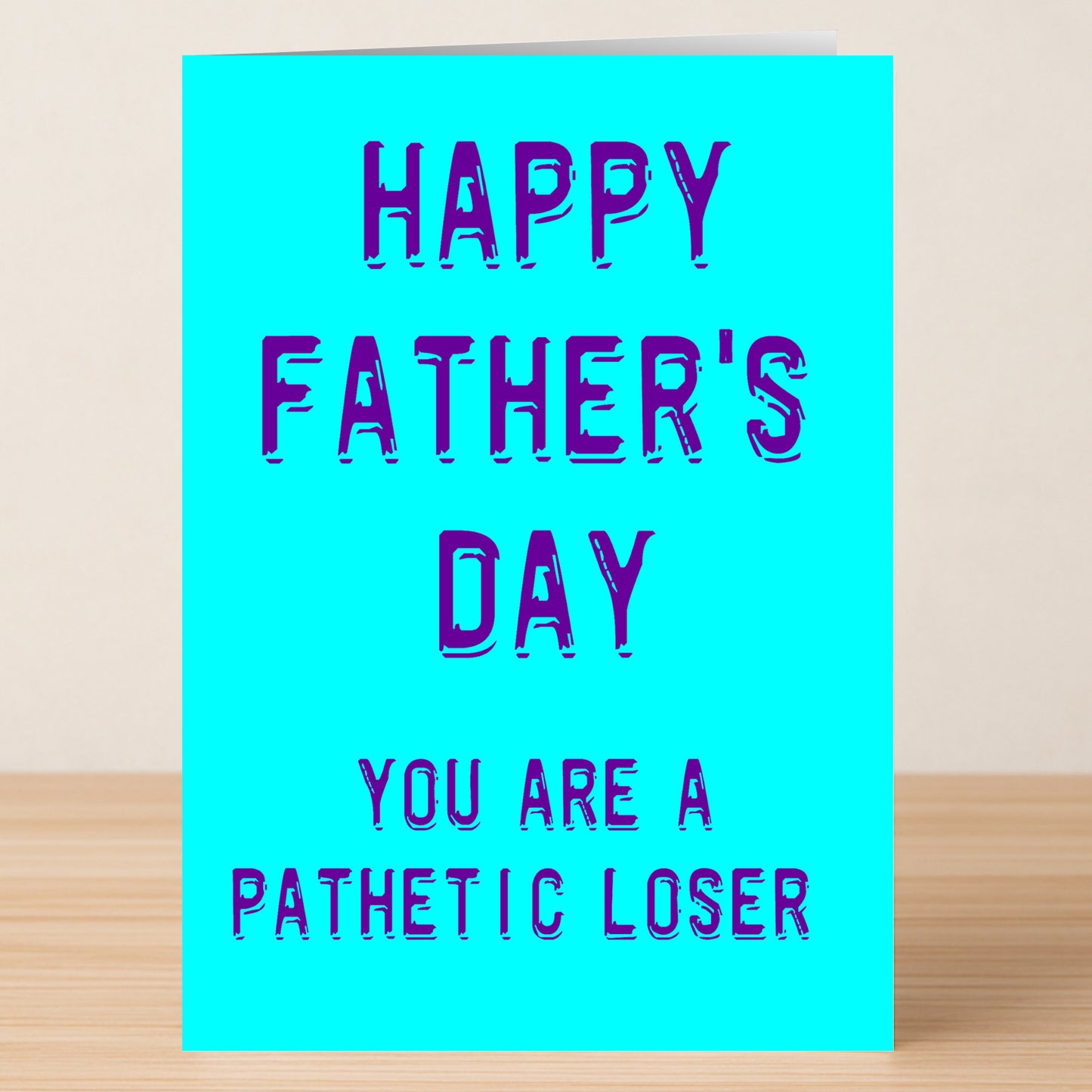 The Loser Rude Father's Day Card by Twisted Gifts is a blue greeting card with "Happy Father's Day. You are a pathetic loser." in bold blue-purple text—perfect for anyone who loves edgy humor.
