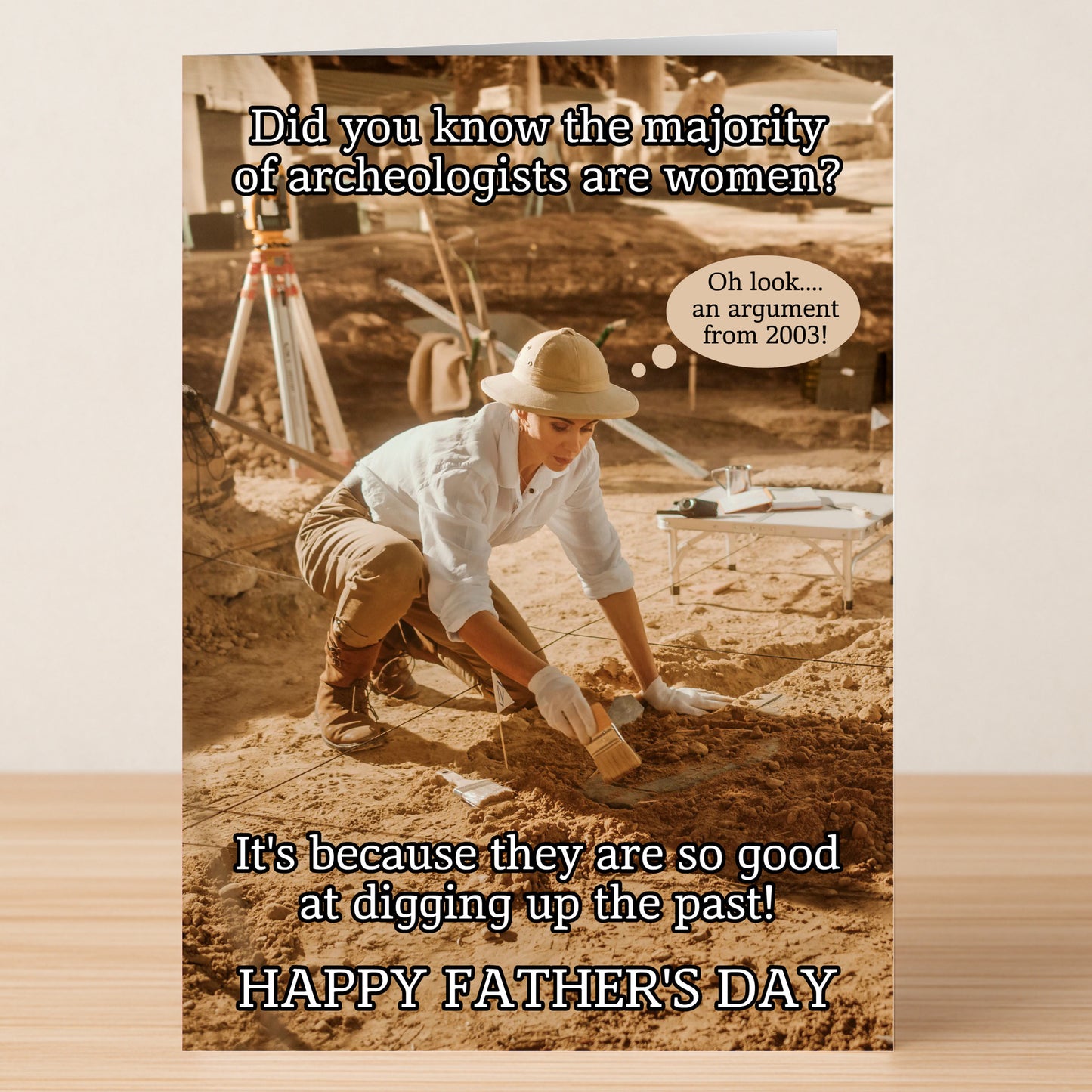 The Twisted Gifts Archeologist Insulting Father's Day Card features a woman archaeologist digging, paired with a witty joke about women digging up the past—ideal for a playful Father’s Day laugh.