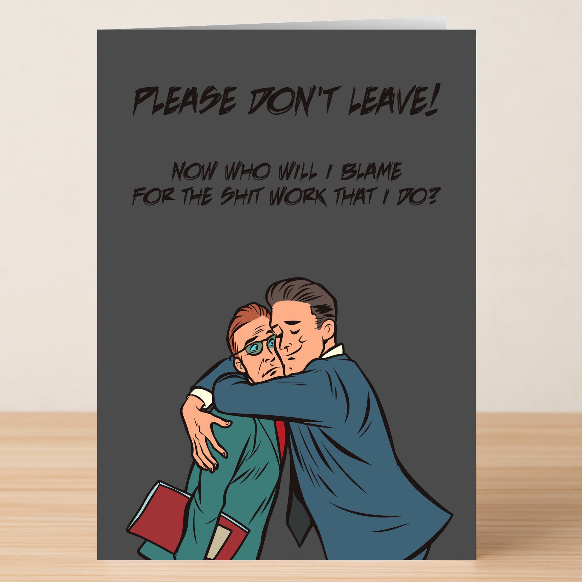 The Shit Work Funny Farewell Card by Twisted Gifts features two men in suits hugging—one sad, one relieved. It's the perfect hilarious card for a coworker’s departure: “Please don't leave! Now who will I blame for the shit work that I do?.