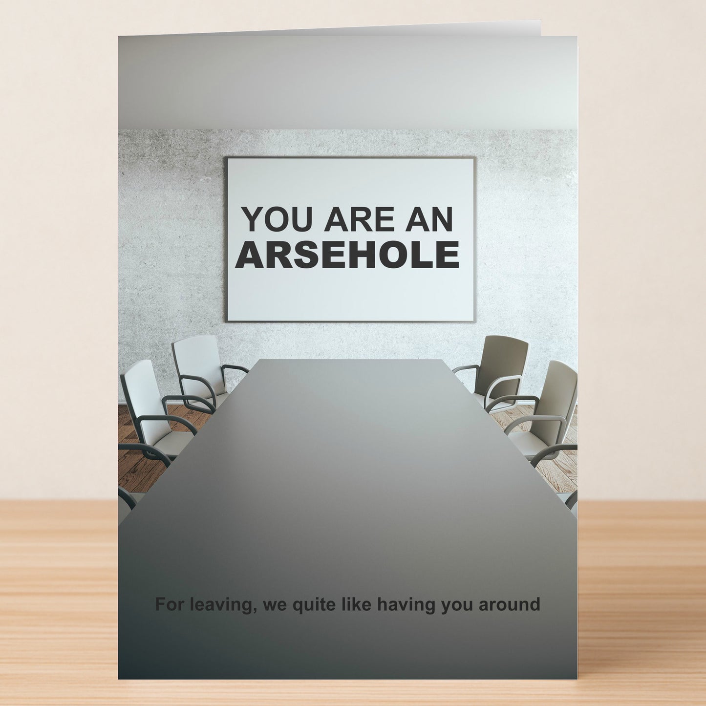 The Arsehole Funny Farewell Card by Twisted Gifts features a conference room with a "YOU ARE AN ARSEHOLE" sign and the message, "For leaving, we quite like having you around." A hilarious card for coworkers.