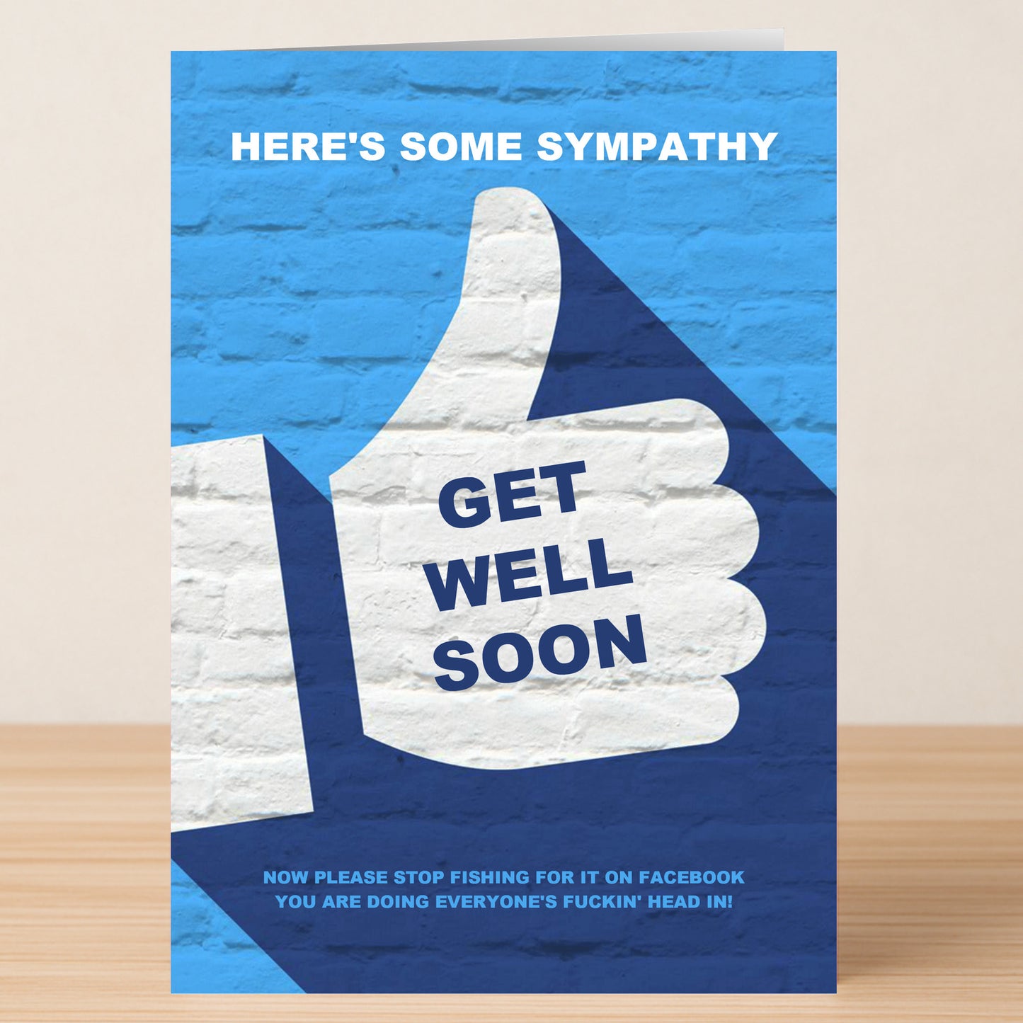 Twisted Gifts' "Sympathy – Insulting Get Well Soon Card" features a thumbs-up and the message: “HERE'S SOME SYMPATHY, GET WELL SOON. Now please stop fishing for it on Facebook—you’re doing everyone’s fuckin’ head in!” Perfect rude humour.