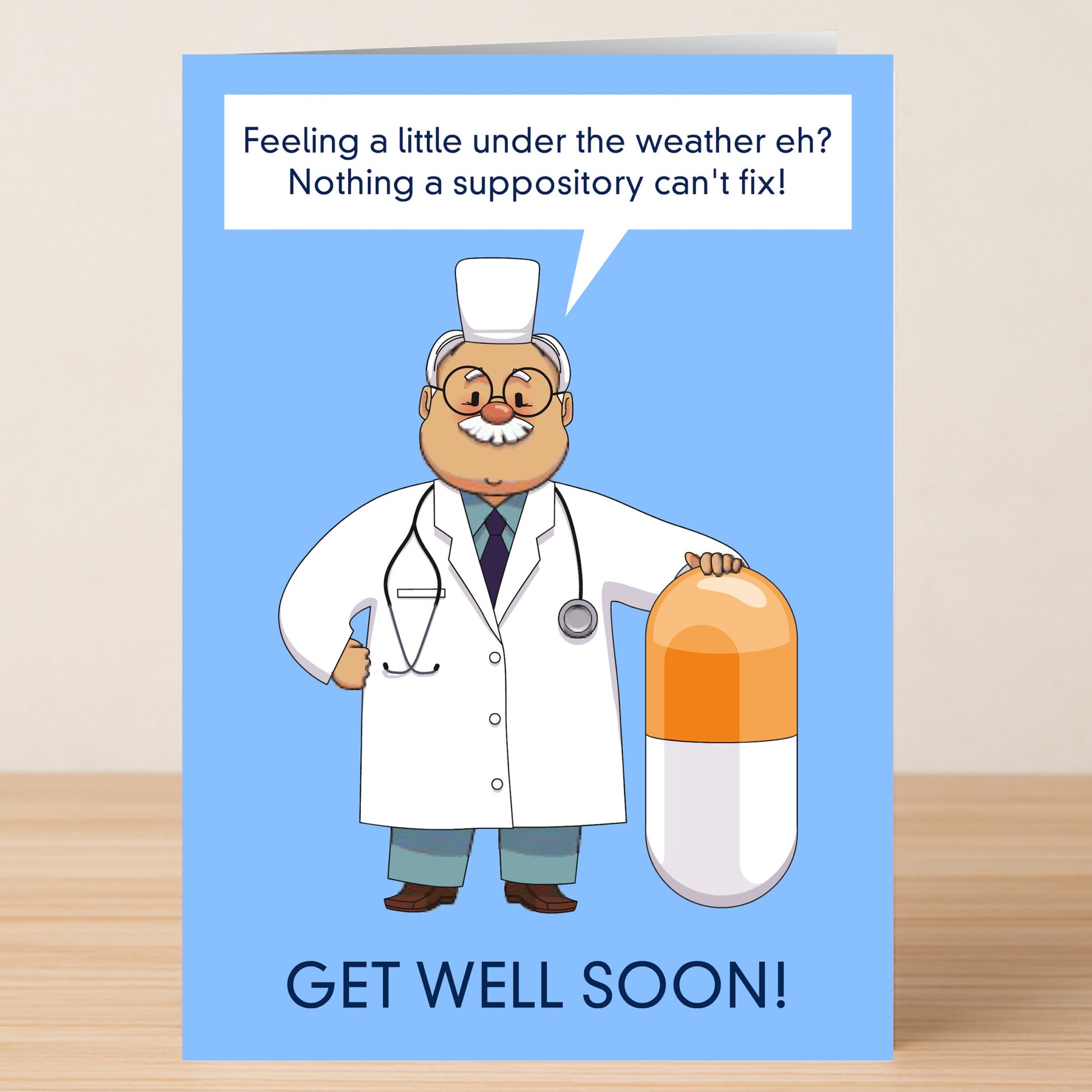 A cheeky "Suppository Rude Get Well Soon Card" from Twisted Gifts featuring a cartoon doctor and capsule with the message: "Feeling a little under the weather, eh? Nothing a suppository can't fix! Get well soon!" Perfect for those with a sense of humor.