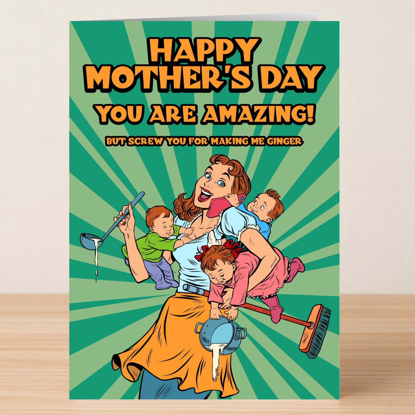 The Ginger Rude Mother's Day Card by Twisted Gifts features a cartoon mom juggling kids and chores with the bold message: "Happy Mother's Day. You are amazing! But screw you for making me ginger." A cheeky card for a sassy laugh.