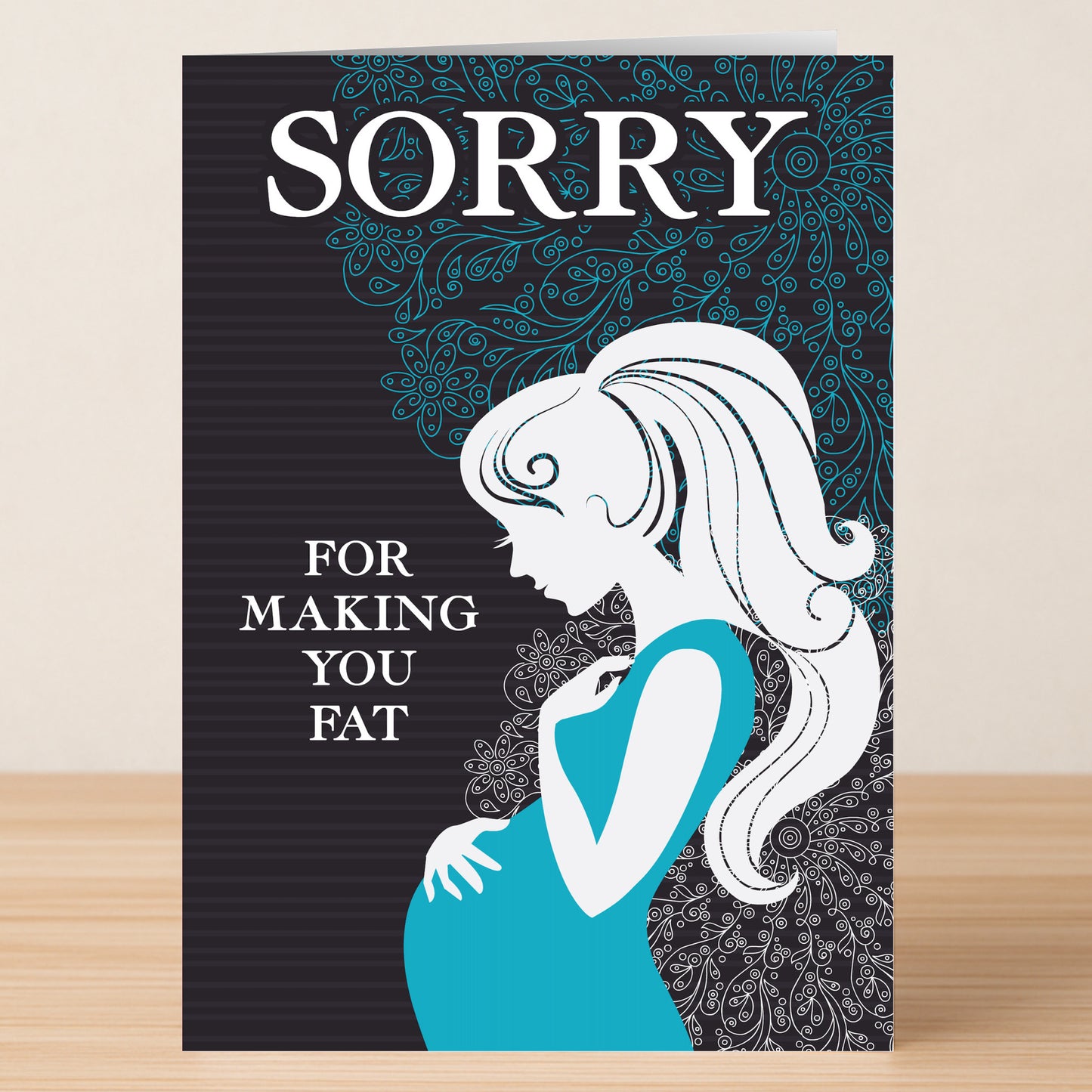 The "Making You Fat – Funny Sorry Card" by Twisted Gifts features a pregnant woman’s silhouette and the text "SORRY FOR MAKING YOU FAT"—a playful, sarcastic apology card perfect for moms-to-be.