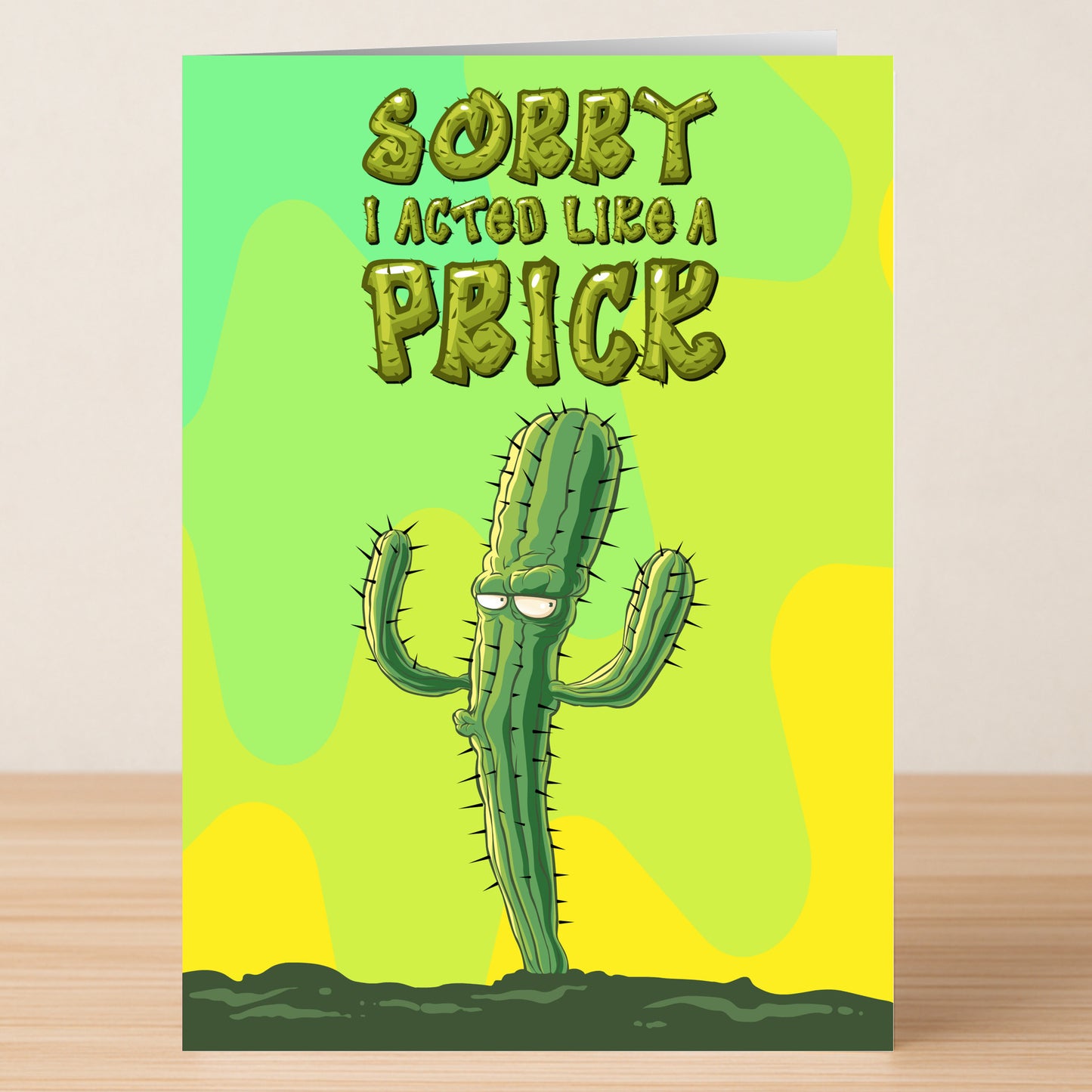 The Like A Prick – Funny Sorry Card by Twisted Gifts features a cartoon cactus and “Sorry I acted like a prick” on a green and yellow background—a perfect sarcastic apology card for lighthearted moments.