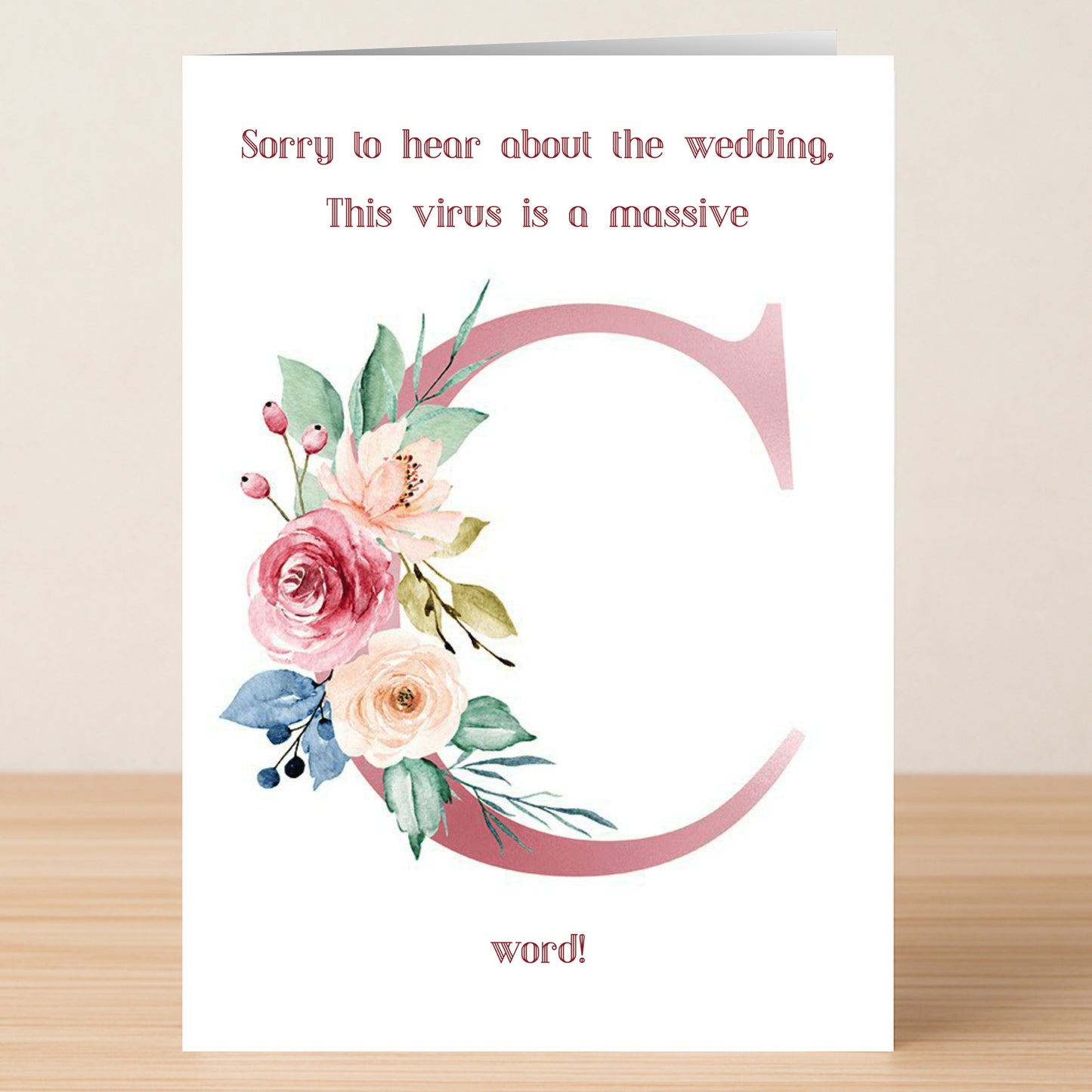 The C Word – Rude Sorry Card by Twisted Gifts features floral artwork and a bold "C," with the message: "Sorry to hear about the wedding. This virus is a massive C word!" A perfect sarcastic apology card for tough times.