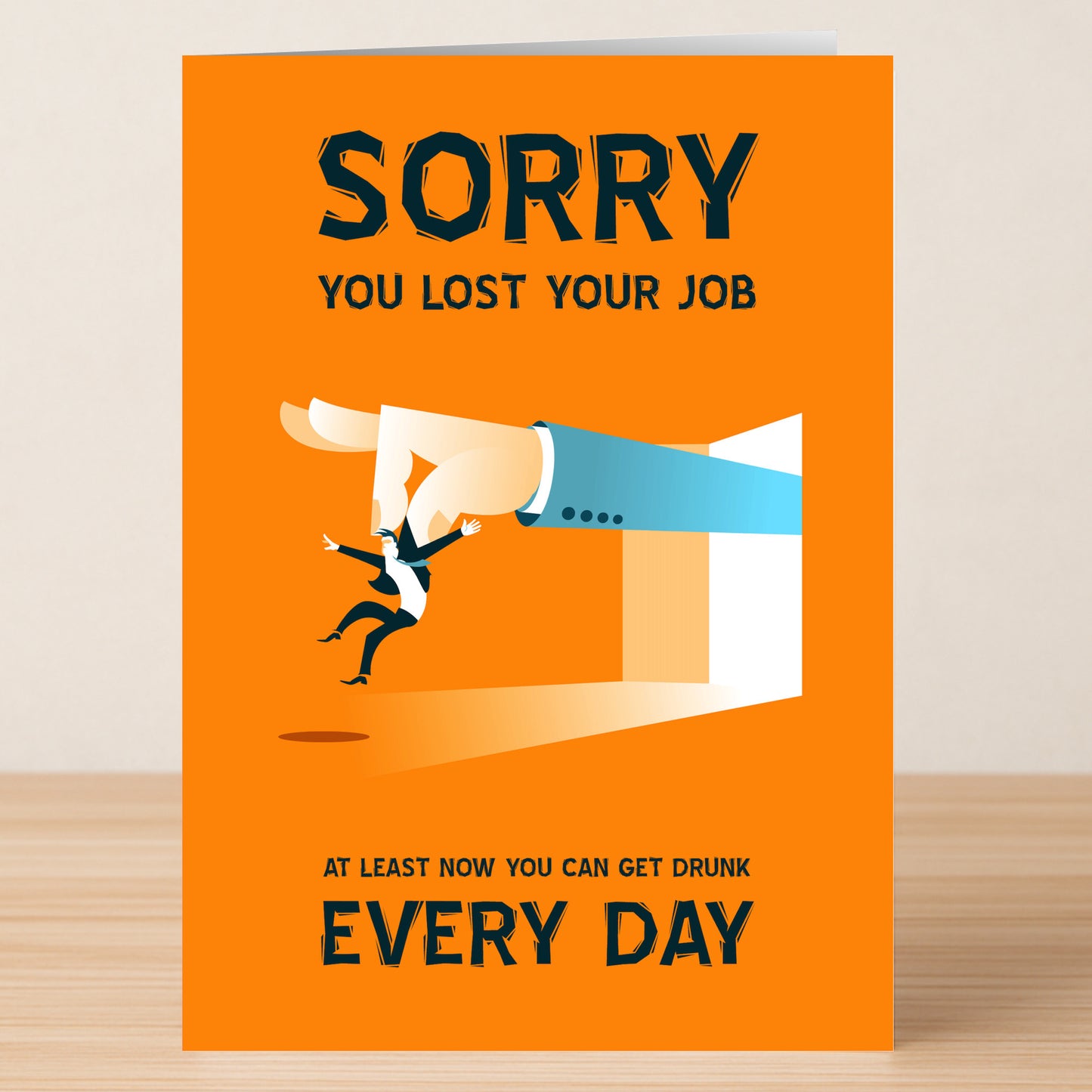 The Every Day – Funny Sorry Card by Twisted Gifts features a cartoon hand flicking a businessperson with the message: "Sorry you lost your job. At least now you can get drunk every day." Perfect for lovers of sarcasm!.