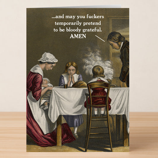 The Amen Rude Thanksgiving Card by Twisted Gifts features a vintage-style family praying at dinner, with a speech bubble of irreverent, sarcastic gratitude—ideal for anyone who appreciates rude holiday cards.