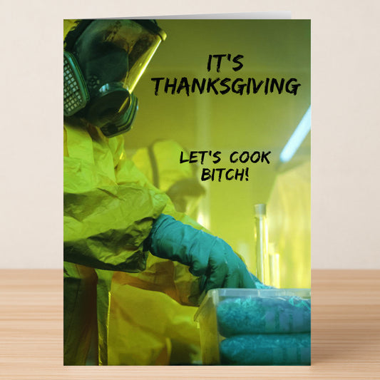 A person in a hazmat suit handles containers in a lab, with "It's Thanksgiving, Let's cook bitch!" overlaid—the Let's Cook Rude Thanksgiving Card by Twisted Gifts is the perfect bold and humorous card for your Thanksgiving celebration.