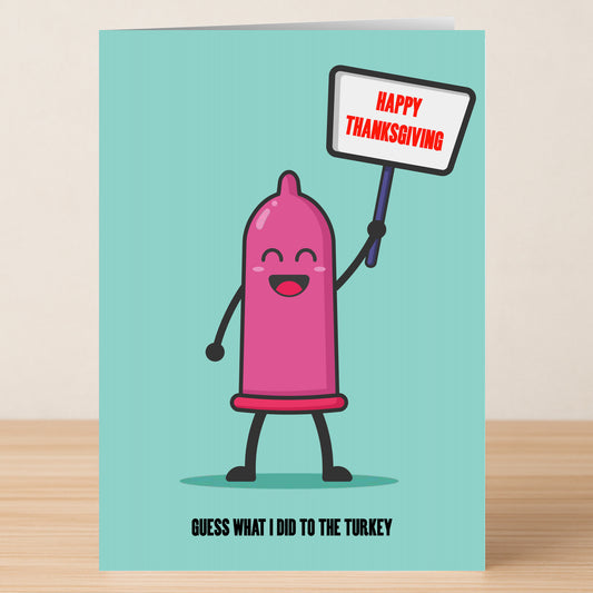 The Guess What I Did Rude Thanksgiving Card by Twisted Gifts features a cartoon condom with a "Happy Thanksgiving" sign and the cheeky caption, "Guess what I did to the turkey," for a humorous holiday touch.