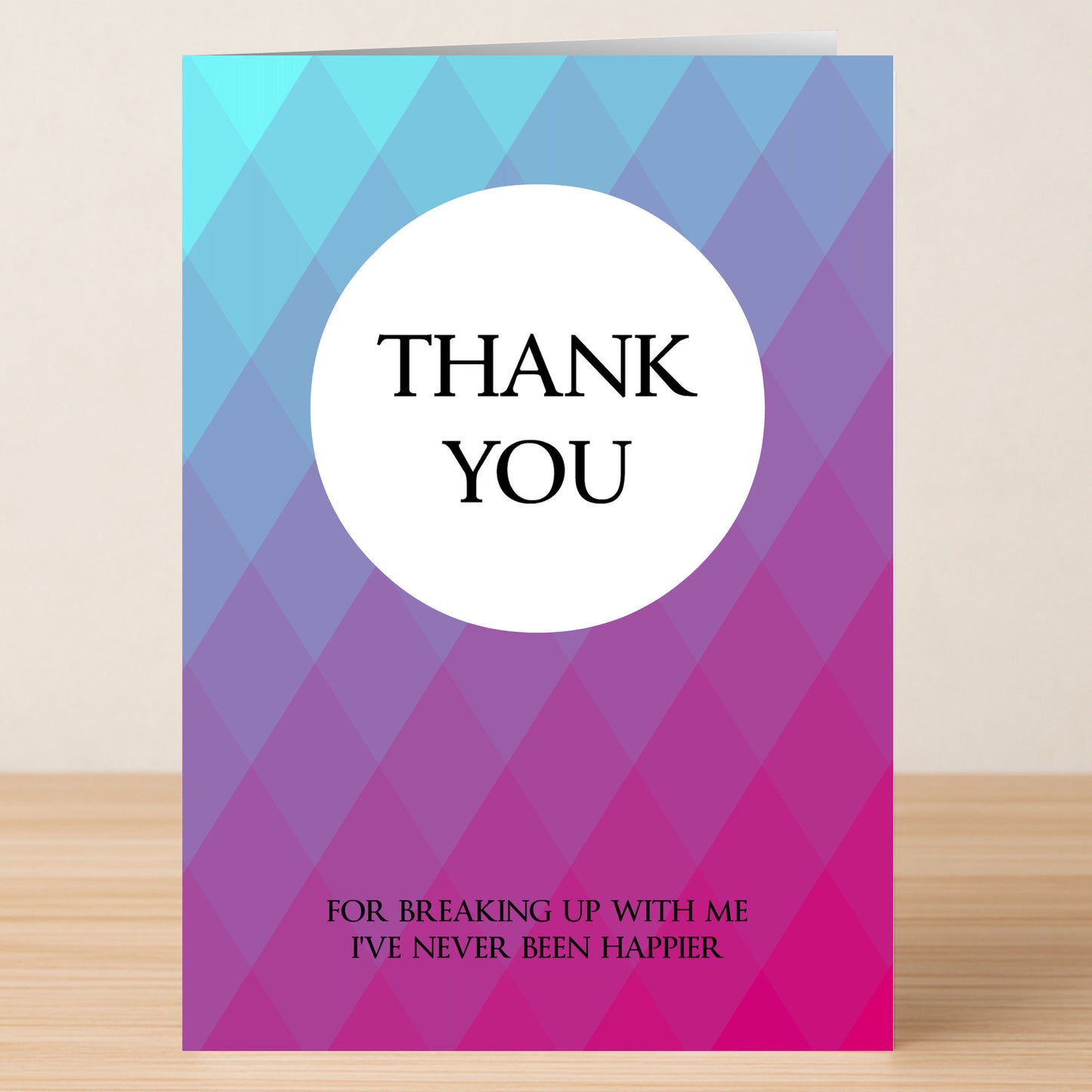 The Never Happier Funny Thank You Card by Twisted Gifts features a blue and purple diamond pattern with "THANK YOU" in a white circle and "For breaking up with me I've never been happier" below—a humorous way to say thanks.