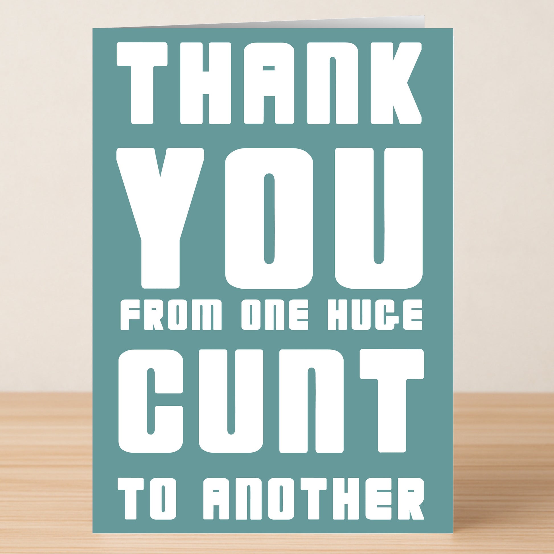 The Huge Cunt Insulting Thank You Card by Twisted Gifts features "THANK YOU FROM ONE HUGE CUNT TO ANOTHER" in bold white text on blue—ideal for anyone seeking a hilariously bold, insulting thank you card.