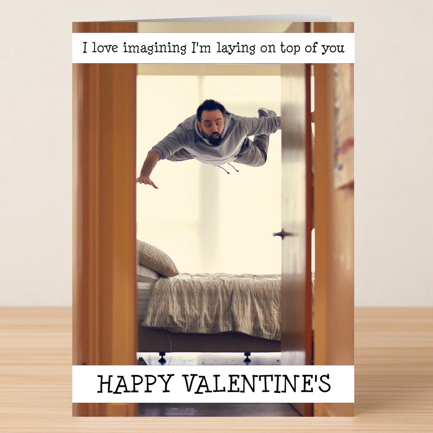 The On Top Rude Valentine's Card by Twisted Gifts features a man flying over a bed with the cheeky message "I love imagining I'm laying on top of you" and "HAPPY VALENTINE'S"—a playful choice for the romantic holiday.