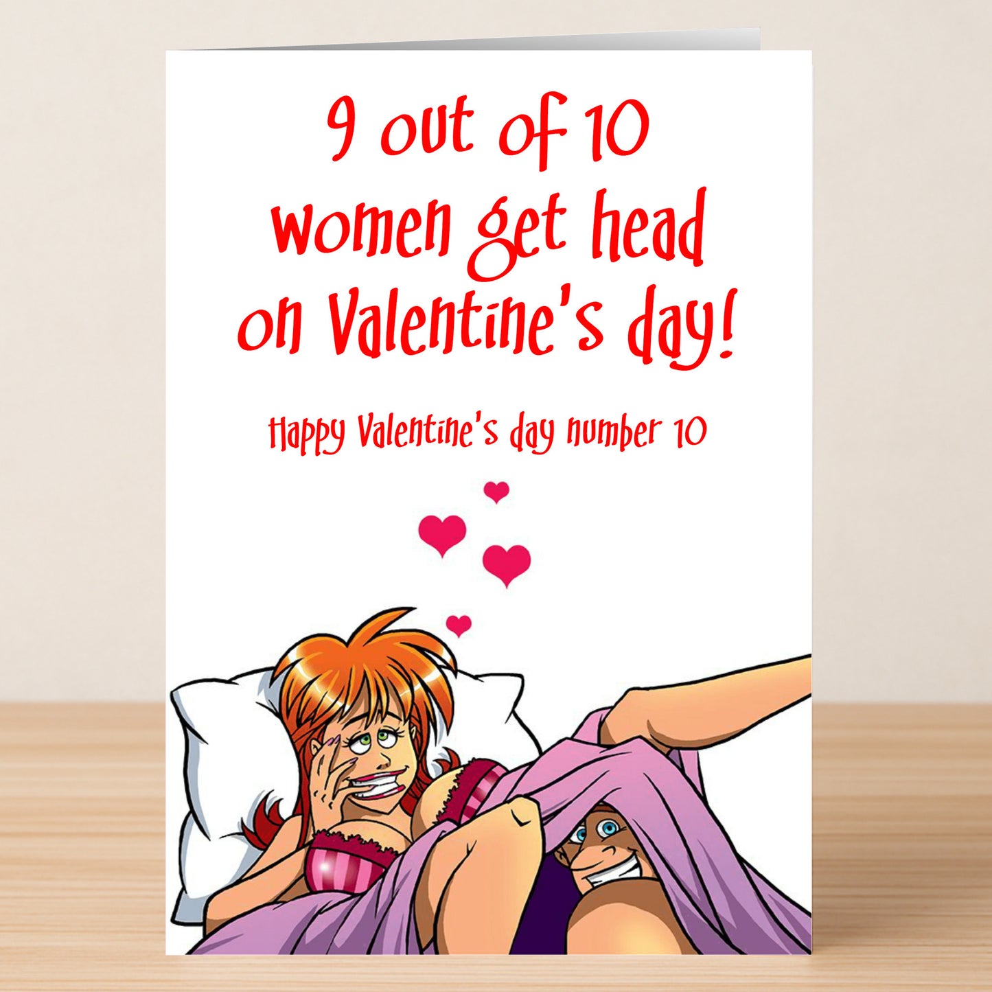 Send a cheeky Valentine’s message with the Number 10 Rude Valentine's Card by Twisted Gifts—a humorous design with a cartoon woman laughing in bed and bold red text, perfect for anyone who loves playful, risqué greetings.