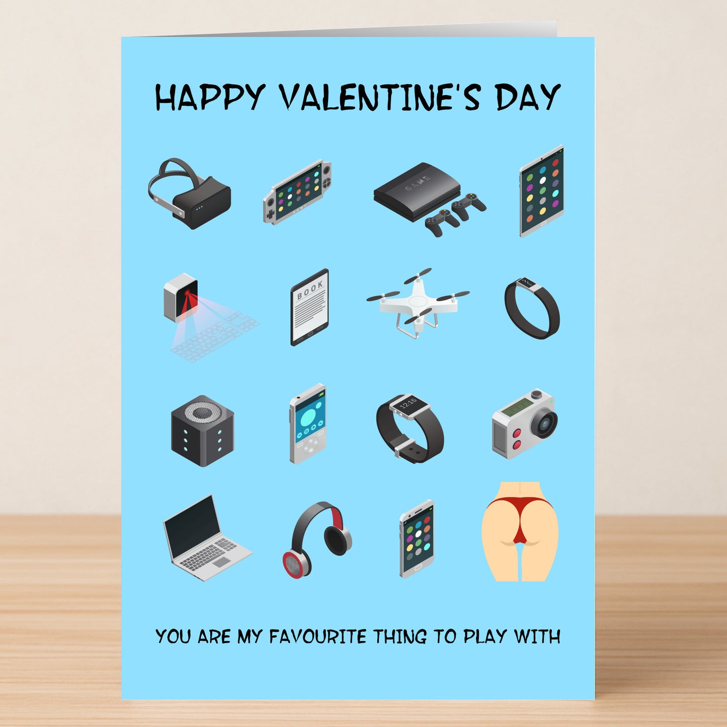 The Favourite Thing Funny Valentine's Card by Twisted Gifts features tech gadget icons and the playful message "You are my favourite thing to play with"—the perfect way to share your love with a sense of humor.