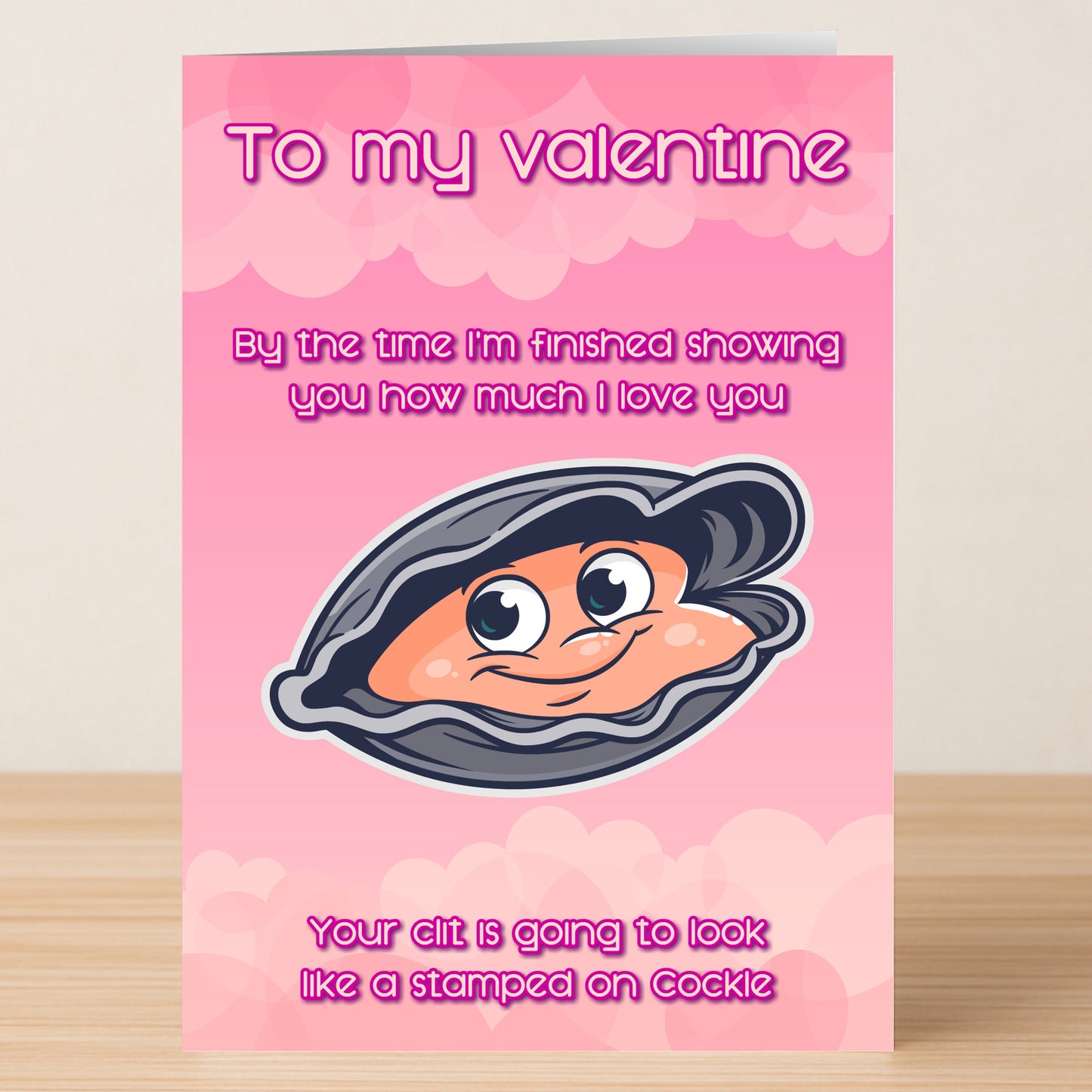 The Cockle Funny Valentine's Card by Twisted Gifts features a pink cover with a cartoon clam and witty love text, plus a stamped-on cockle—making it a playful Valentine’s Day greeting card.