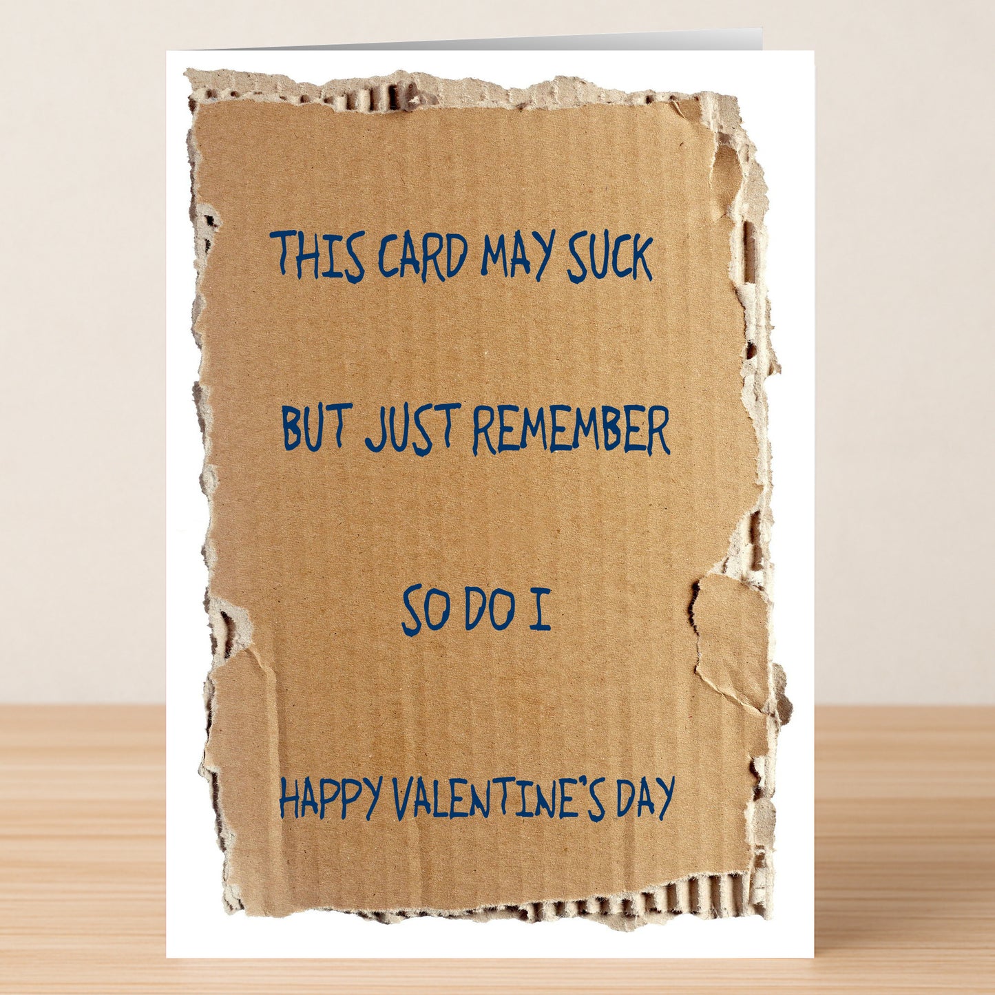 The "This Card May Suck Funny Valentines Card" by Twisted Gifts features a torn cardboard design with the message: “This card may suck but just remember so do I. Happy Valentine's Day.”.