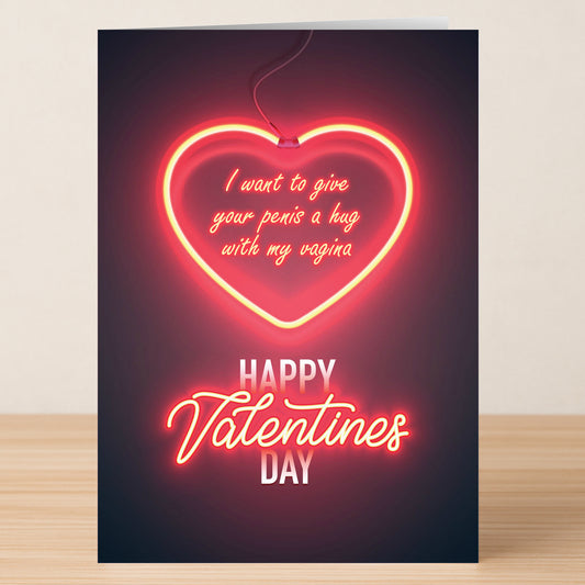The Hug Rude Valentines Card by Twisted Gifts features a neon heart and bold, cheeky message: "I want to give your penis a hug with my vagina. Happy Valentines Day." Perfect for anyone who loves offbeat humor on Valentine’s Day!.