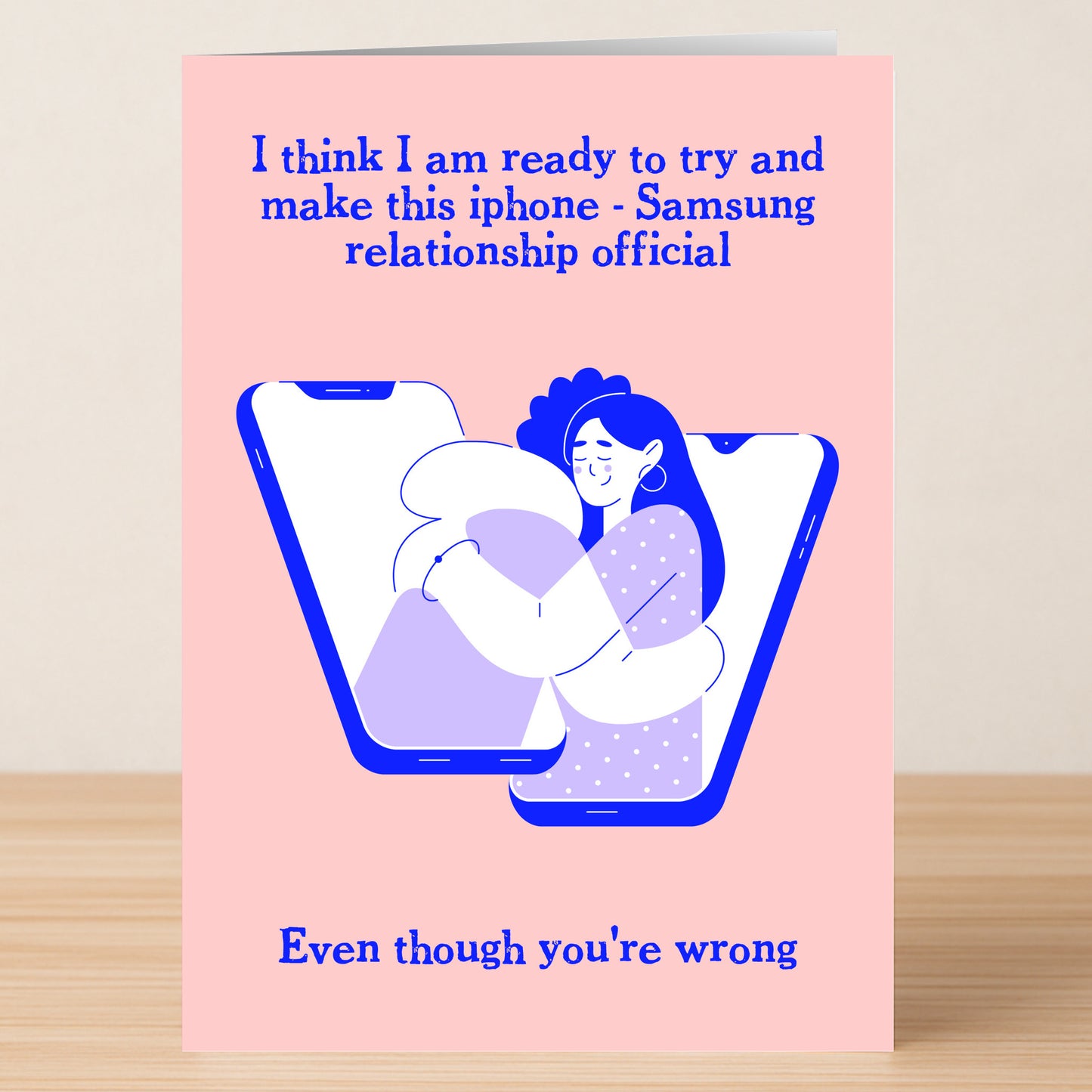 The Official Rude Valentines Card by Twisted Gifts delivers humor with two people hugging from phones and the message: "I think I am ready to make this iPhone - Samsung relationship official. Even though you're wrong.