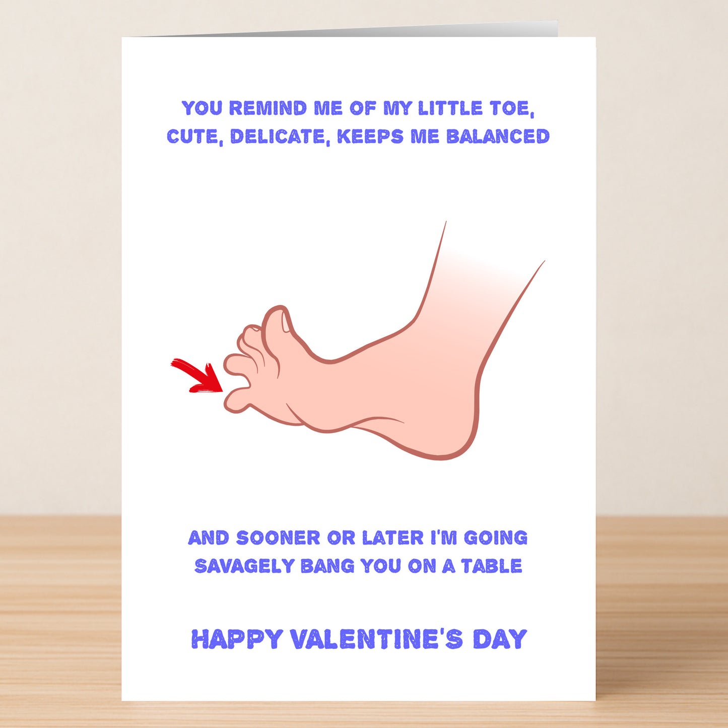 Twisted Gifts’ On The Table Funny Valentines Card features a quirky foot illustration and witty text about stubbing your toe—perfect for sharing laughs and love this Valentine’s Day!.