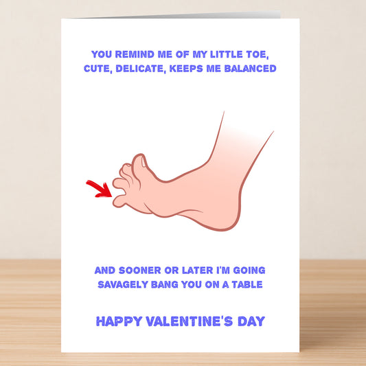 Twisted Gifts’ On The Table Funny Valentines Card features a quirky foot illustration and witty text about stubbing your toe—perfect for sharing laughs and love this Valentine’s Day!.