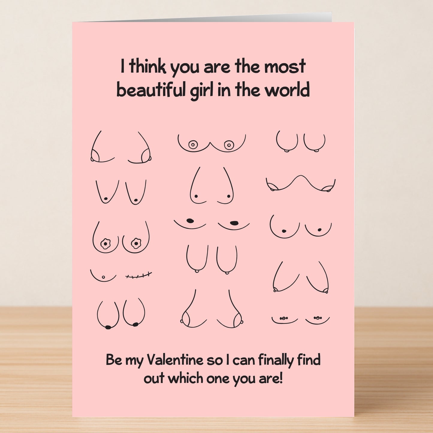 The Find Out Rude Valentines Card by Twisted Gifts features simple pink line drawings of different breasts and the message: "I think you are the most beautiful girl in the world. Be my Valentine so I can finally find out which one you are!.