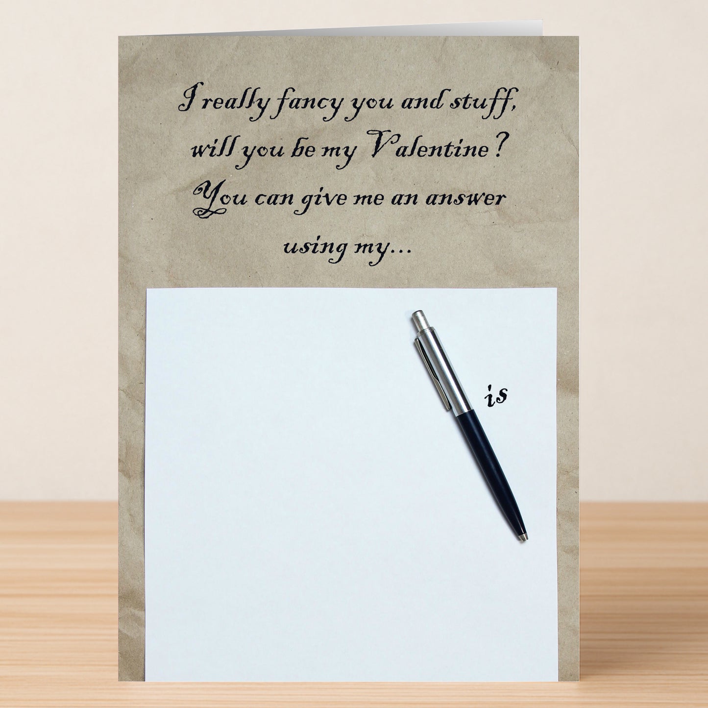 The "Pen Is Rude Valentines Card" by Twisted Gifts is a funny Valentine's Day card that reads, "I really fancy you and stuff, will you be my Valentine? You can give me an answer using my..." above a pen on paper, playfully completing the cheeky phrase.