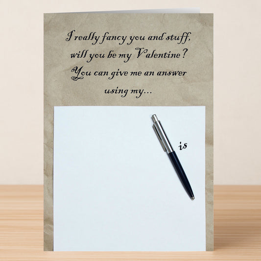 The "Pen Is Rude Valentines Card" by Twisted Gifts is a funny Valentine's Day card that reads, "I really fancy you and stuff, will you be my Valentine? You can give me an answer using my..." above a pen on paper, playfully completing the cheeky phrase.