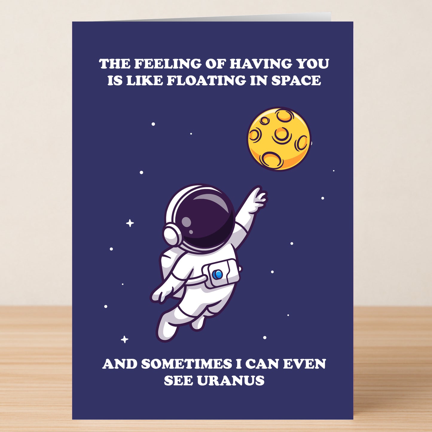The Uranus Valentines Card by Twisted Gifts features a cheeky astronaut reaching for a yellow planet, with the message: "The feeling of having you is like floating in space—and sometimes I can even see Uranus.