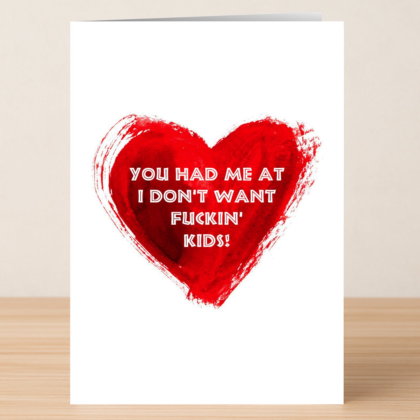 The Kids Funny Valentine’s Card by Twisted Gifts features a red heart and the message "You had me at I don't want fuckin' kids!"—a hilarious card for couples who love to laugh, perfect for Valentine’s Day.