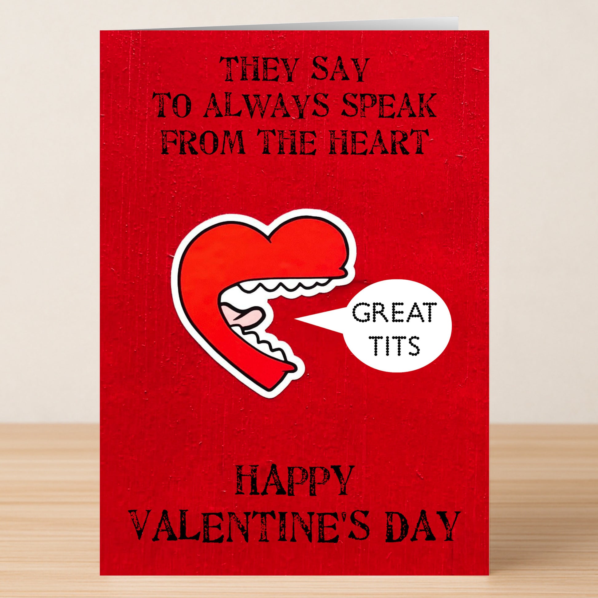 The Twisted Gifts Great Tits Rude Valentine's Card features an illustrated red open mouth with "Great tits" and the message: "They say to always speak from the heart. Happy Valentine's Day.