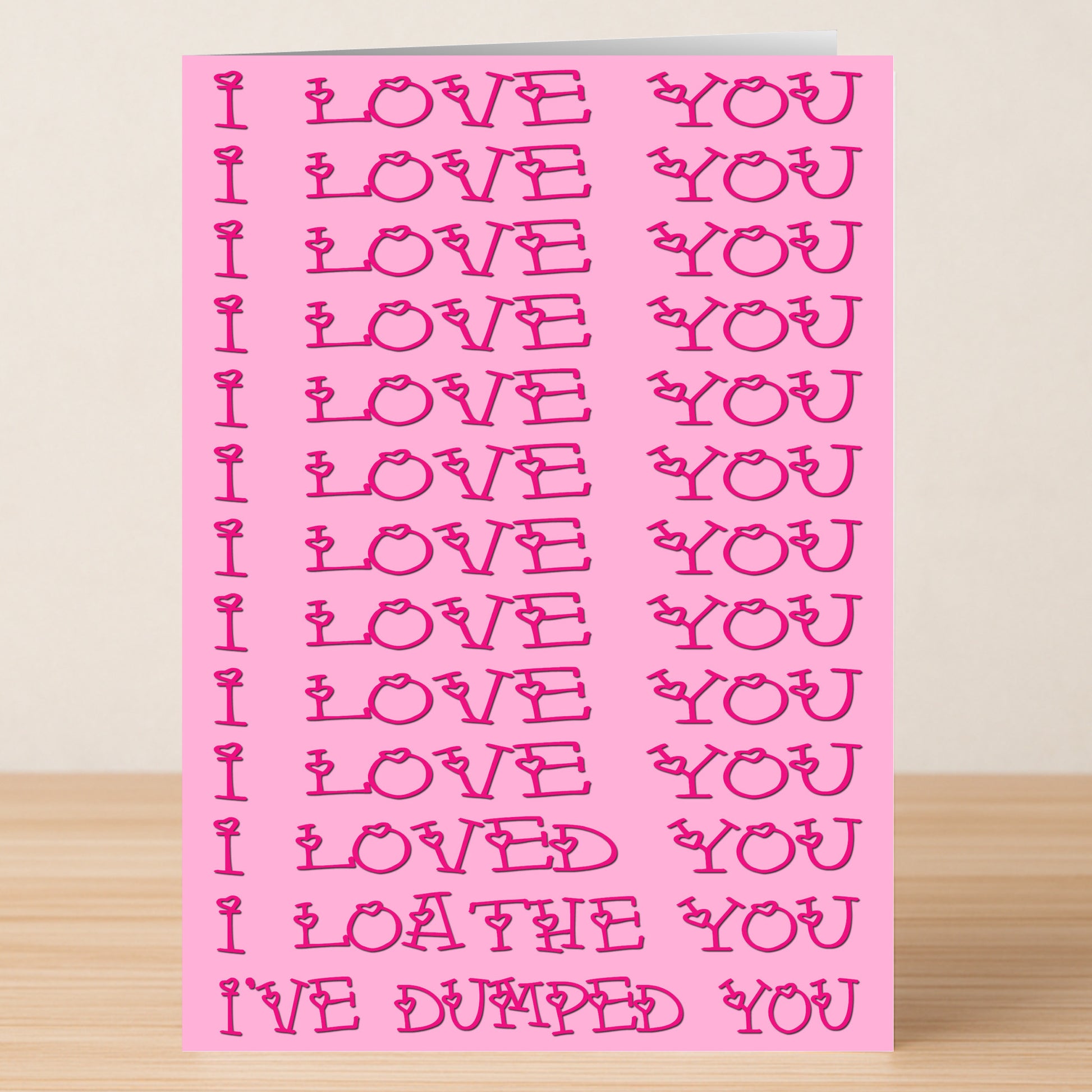 The Loathe You Funny You're Dumped Card by Twisted Gifts is a pink breakup card with repeated "I LOVE YOU" in red, ending humorously with "I LOATHE YOU" and "I'VE DUMPED YOU" at the bottom for a lighthearted message.