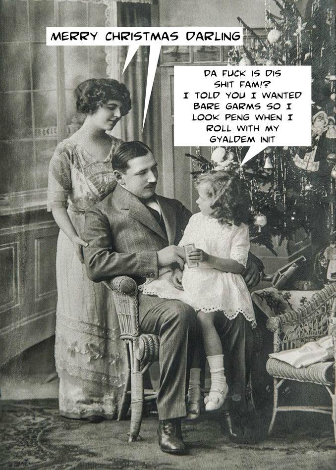 A Twisted Gifts Gyaldem Funny Christmas Card featuring an old photo of a woman and a child sitting next to a Christmas tree.