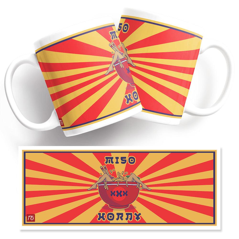 A Miso Horny Mug from Twisted Gifts with a red and yellow sunburst design.