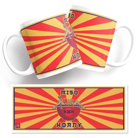 A Miso Horny Mug from Twisted Gifts with a red and yellow sunburst design.