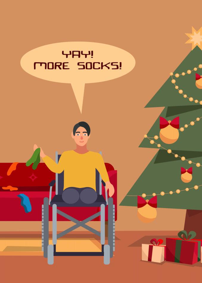 A man in a wheelchair sitting in front of a Christmas tree wearing Twisted Gifts' More Socks Funny Christmas Card.