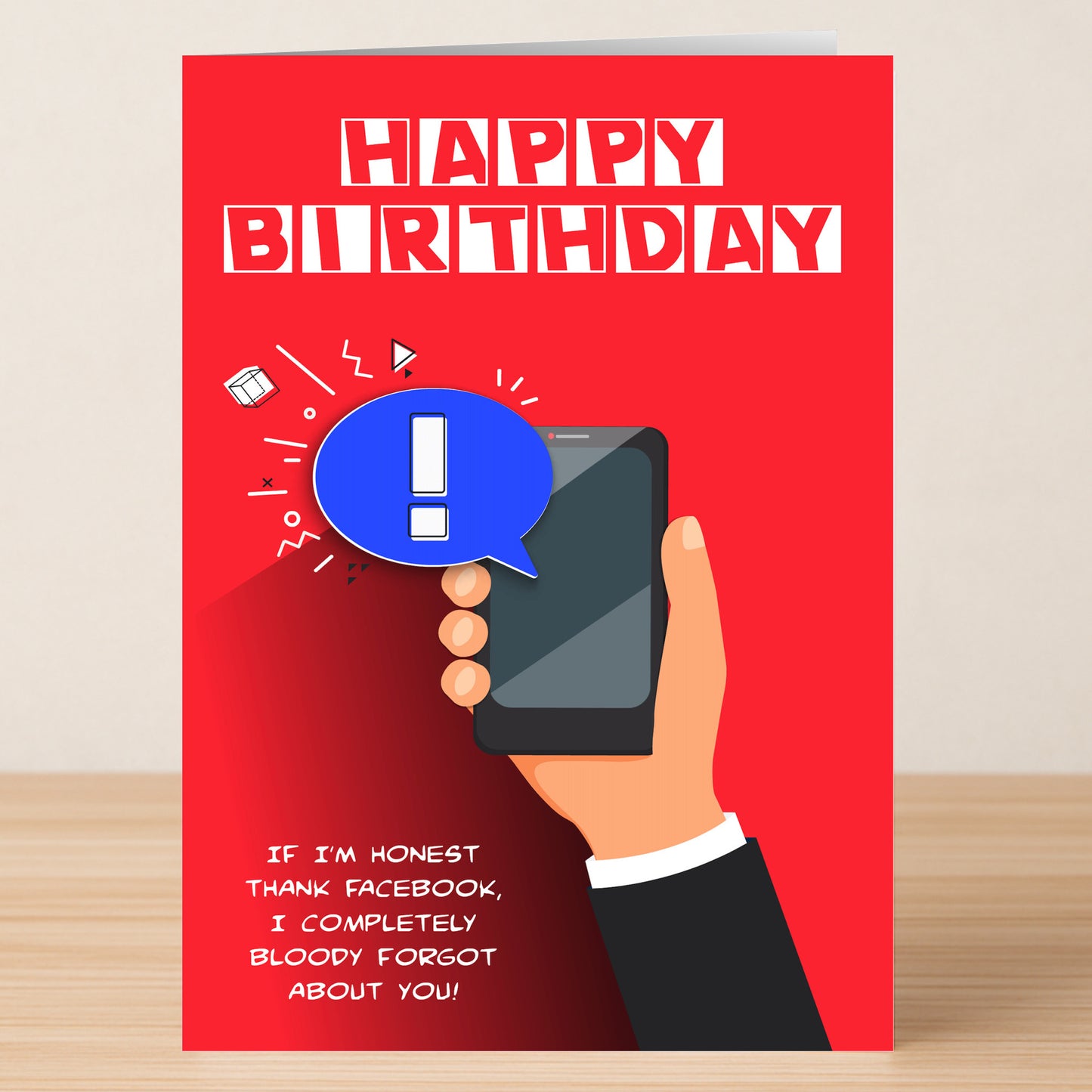 The Twisted Gifts Facebook – Funny Birthday Card features a red design with a hand holding a smartphone and the text: "If I'm honest thank Facebook, I completely bloody forgot about you!.