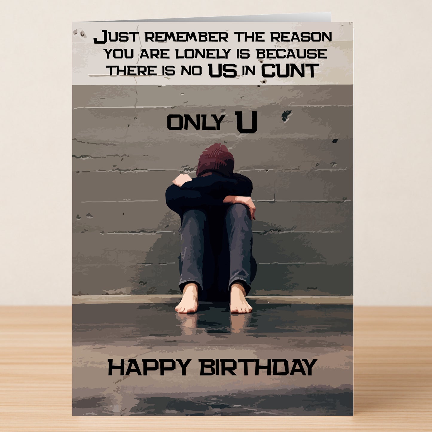 The "Lonely – Insulting Birthday Card" by Twisted Gifts features a person sitting alone, with text that humorously highlights loneliness by censoring an expletive, making it an extra insulting birthday card.