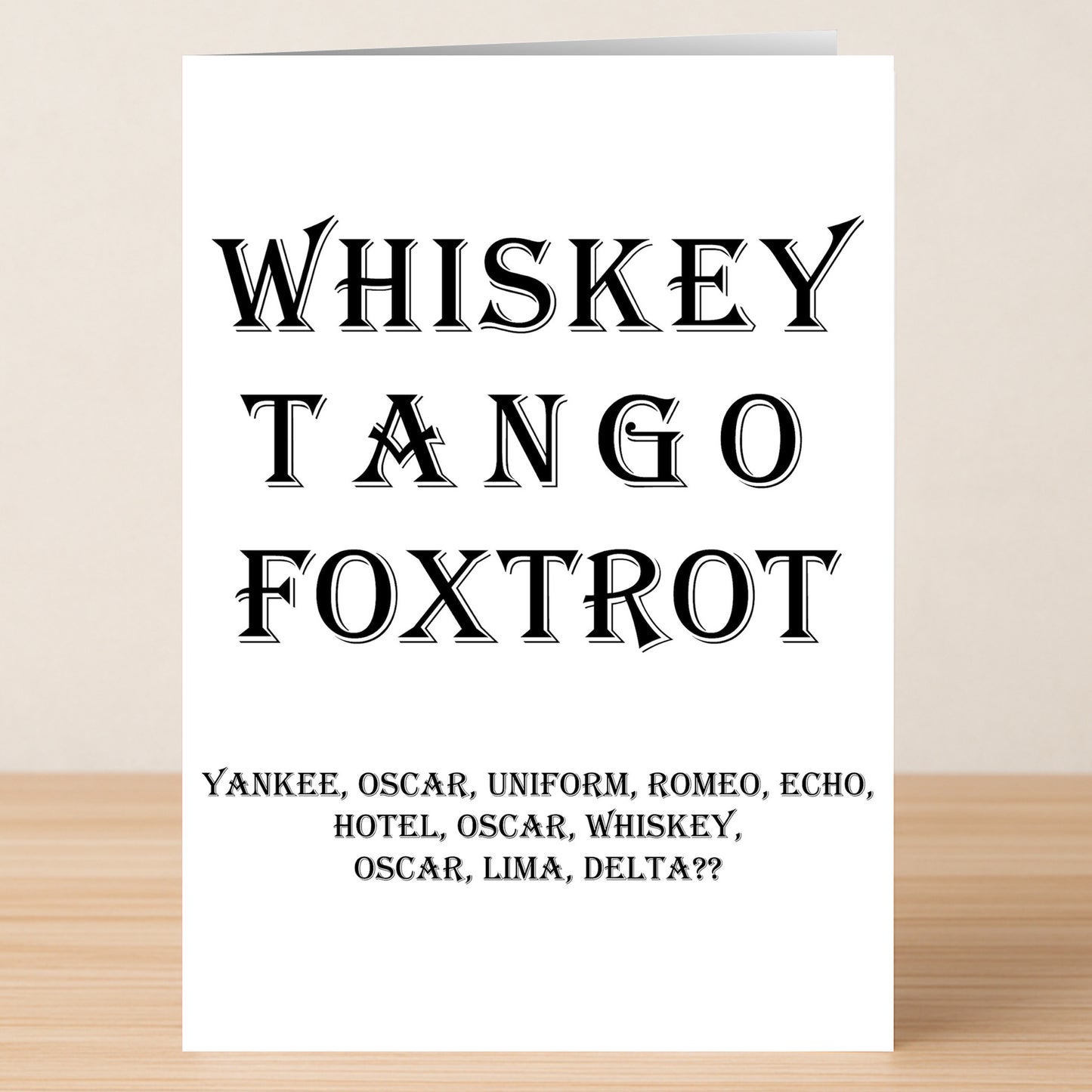 The "What The Fuck – Funny Birthday Card" by Twisted Gifts features "Whiskey Tango Foxtrot" in bold and, for a cheeky twist, smaller text below spelling out "Yankee Oscar Uniform Romeo Echo Hotel Oscar Whiskey Oscar Lima Delta??".