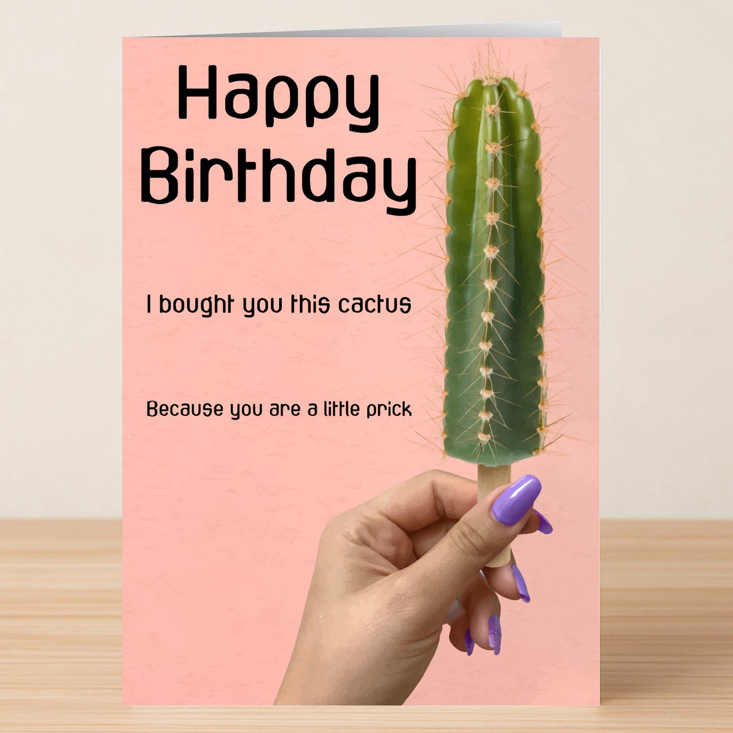 A hand with purple nails holds the "Little Prick – Insulting Birthday Card" by Twisted Gifts, featuring a cactus and the text: "Happy Birthday. I bought you this cactus because you are a little prick.
