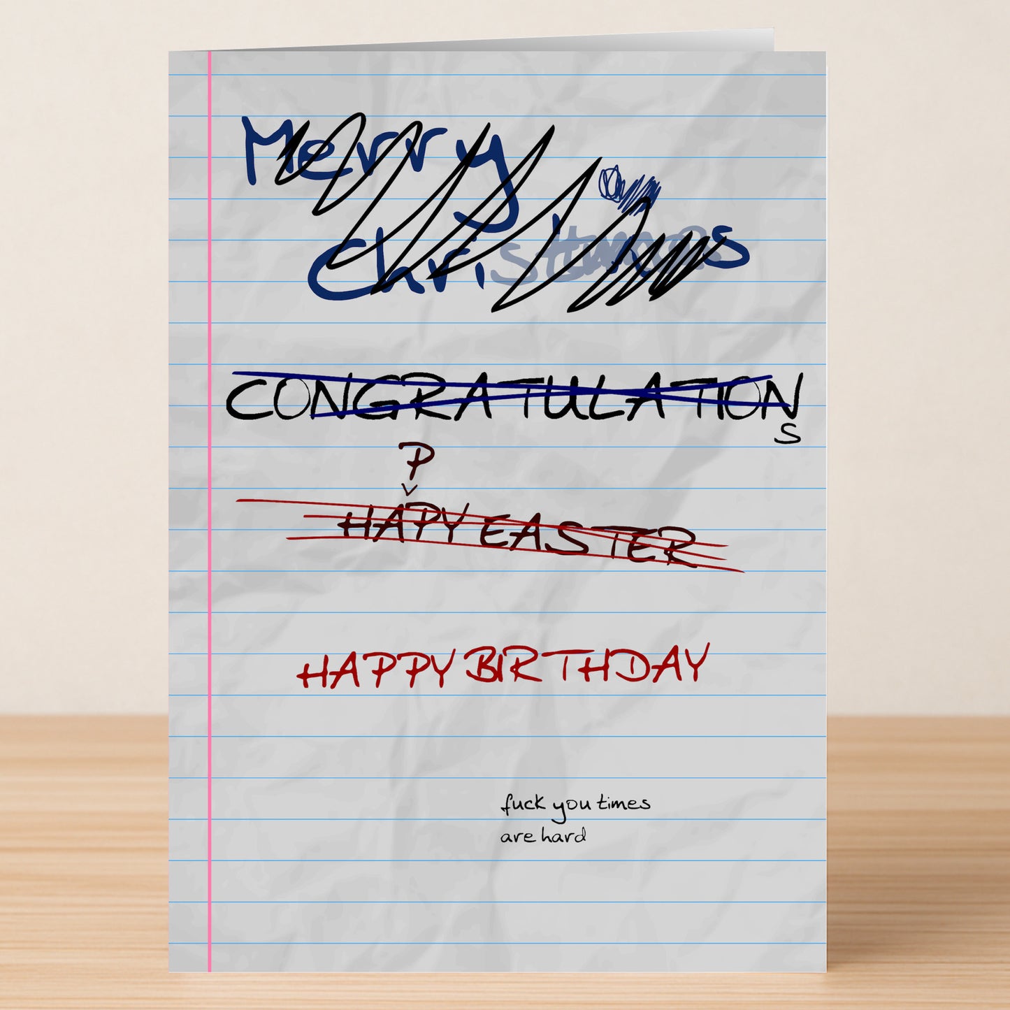 The Hard Times – Funny Birthday Card by Twisted Gifts features crossed-out greetings, a bold "HAPPY BIRTHDAY," and the phrase "fuck you times are hard." A perfect rude birthday card for anyone who loves dark humor.