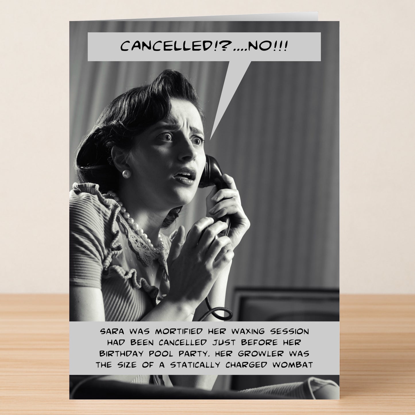 A woman appears shocked on the phone as funny text describes her panic over a cancelled wax before a party—perfect for drama lovers! Wombat – Funny Birthday Card by Twisted Gifts.