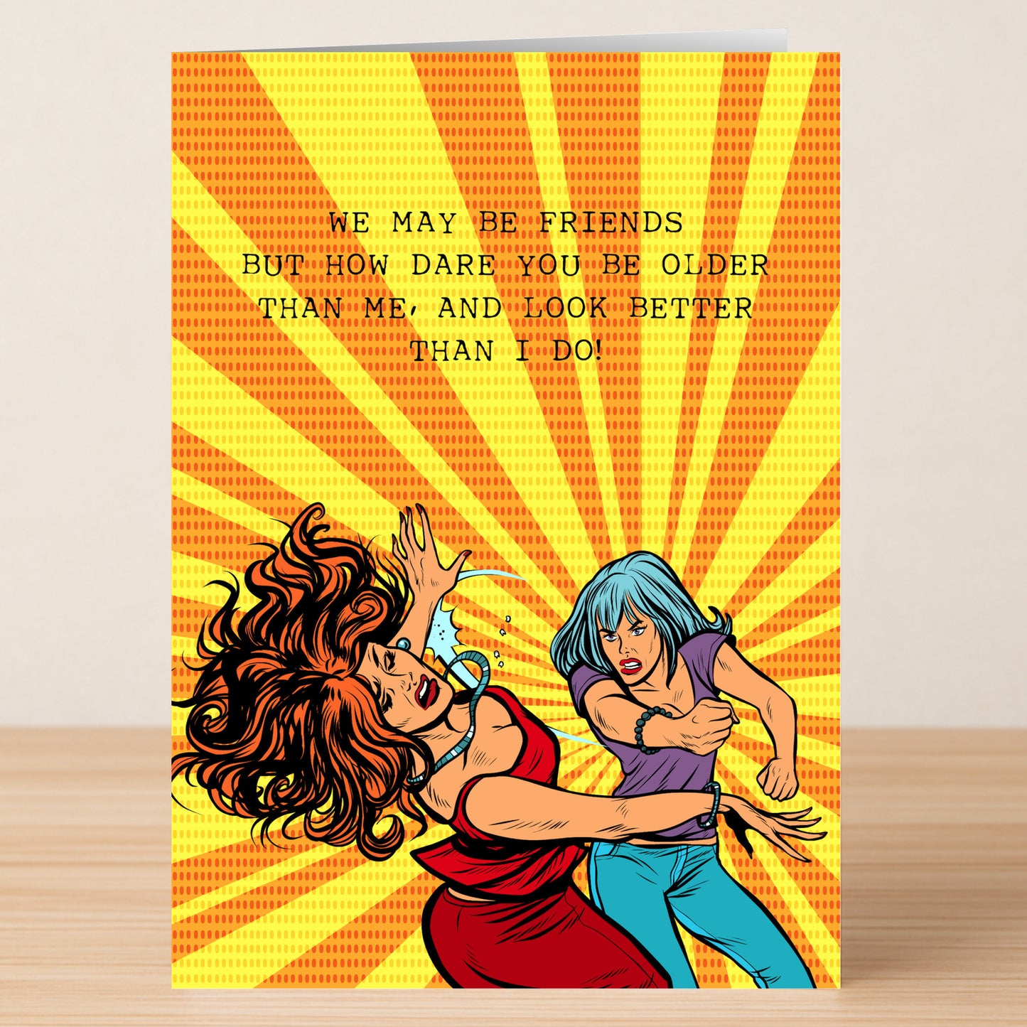 The "How Dare You – Funny Birthday Card" by Twisted Gifts features two comic-style women facing off with the text: "We may be friends but how dare you be older than me, and look better!" Perfect for your fiercest friend’s birthday.