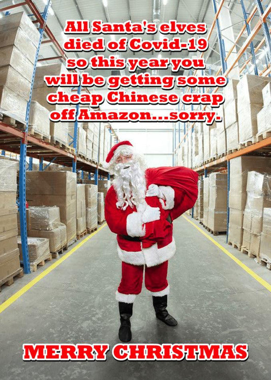 Santa Claus in a warehouse, surrounded by Santa's elves and holding a Twisted Gifts Amazon Funny Christmas Card.