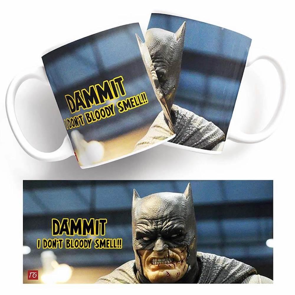 A Twisted Gifts Batman Smells mug with the word 'dammit'.