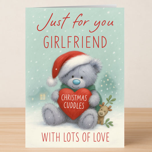 The Girlfriend Bear Christmas Card by Twisted Gifts features a teddy in a Santa hat holding a heart labeled "Christmas Cuddles" with "Just for you Girlfriend With Lots of Love" on the front—perfect for your girlfriend this Christmas.