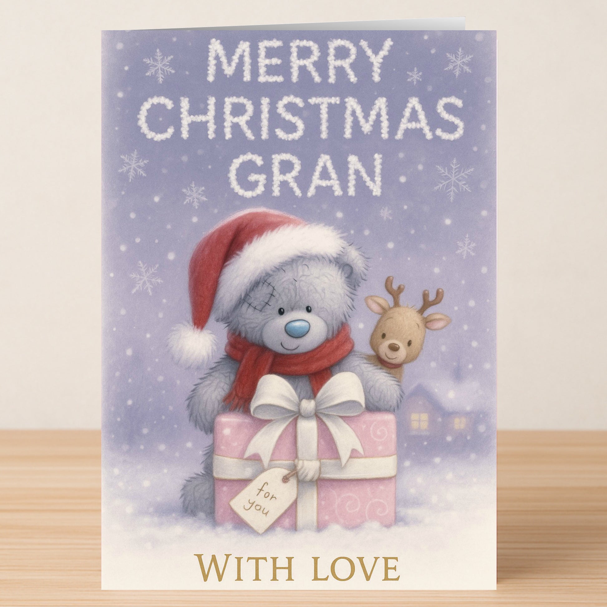 The Gran Bear Christmas Card from Twisted Gifts features a teddy bear in a Santa hat with presents, snowy backdrop, and festive "Merry Christmas Gran" and "With Love" messages—an ideal holiday card for your grandmother.